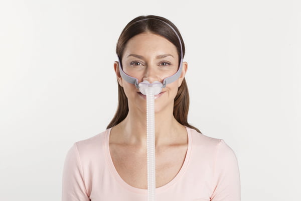 Nasal CPAP mask on woman face perfect fit.